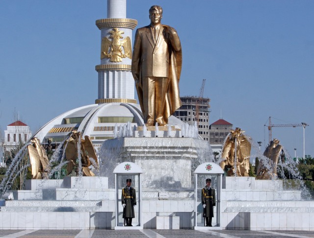 Two soldiers stand in front of a statue of Turkmenistan's late leader Saparmurat Niyazov, a day before the inauguration of new President Gurbanguli Berdymukhamedov in Ashgabat, Tuesday, Feb. 13, 2007. Turkmenistan's first Internet cafes opened in the capital Ashgabat Friday, Feb.16, 2007 as the tightly controlled country's new president declared that all schools will also soon have Internet access. The move comes two days after officials confirmed as Berdymukhamedov, who has pledged make other changes from the path set by the late autocratic leader Niyazov. (AP Photo/Burhan Ozbilici)